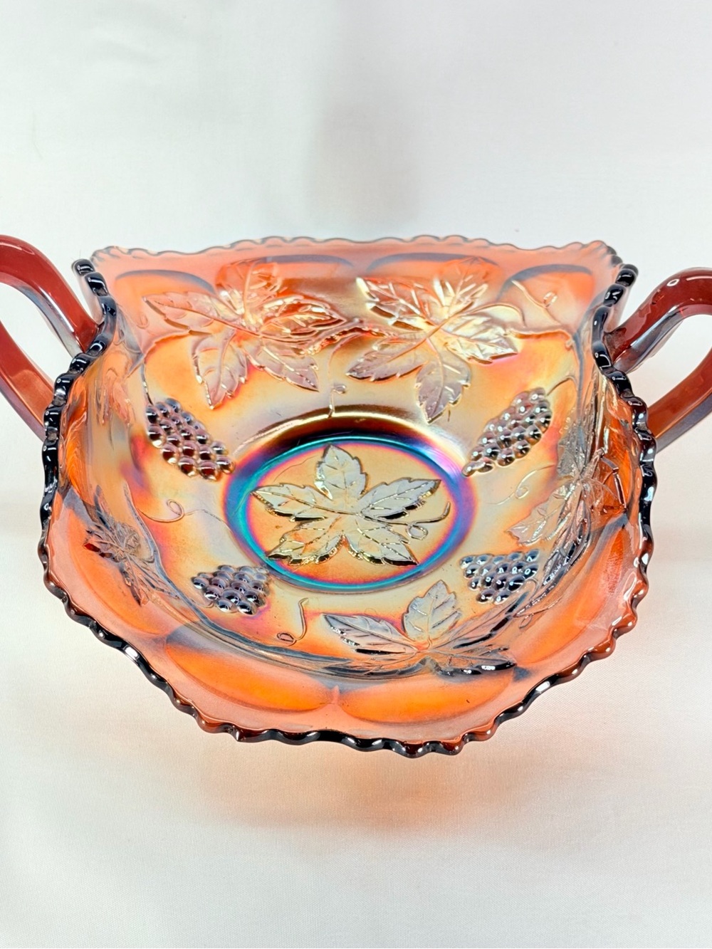 Fenton Iridescent Amber-Orange Leaf & Grape Two-Handled Bowl
